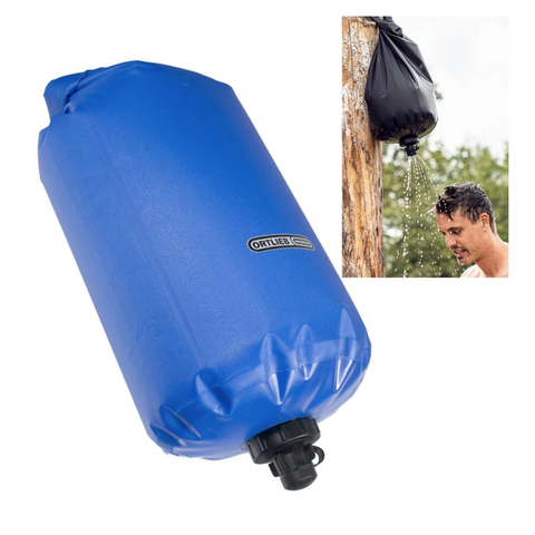 Blue portable water filter system with a man using it outdoors.