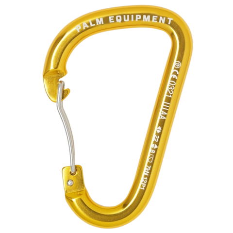 A close up picture of a golden coloured karabiner embossed with white writing detailing the manufacturer and its performance specifications against a white background. 