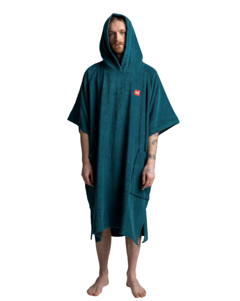 Person wearing a teal hooded towel on a white background