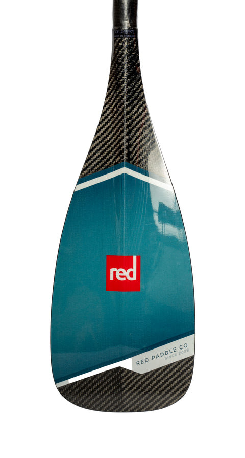 The blade of a three-piece Red Paddle Co paddle with blue blades and a black shaft.