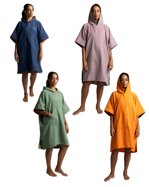 Four people wearing hooded ponchos in blue, pink, green, and orange on a white background.