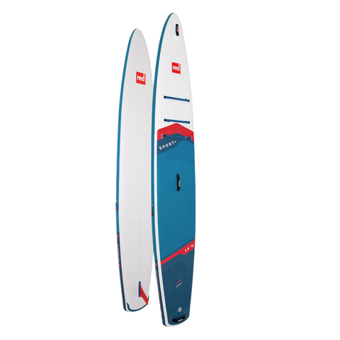 Full length image of both the top and bottom of a red, white and blue paddleboard. The board is standing on its tail and s brand logo and lettering.includes