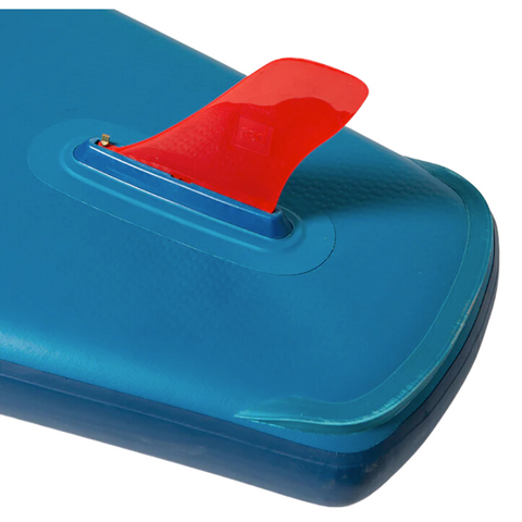 close up image of a red fin fitted to blue paddleboard.
